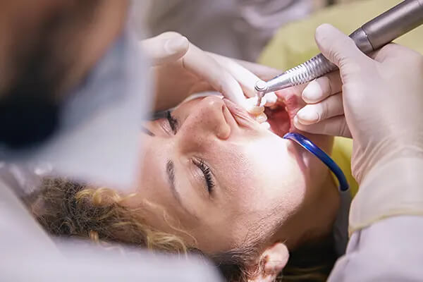 Patient at teeth treatment procedure